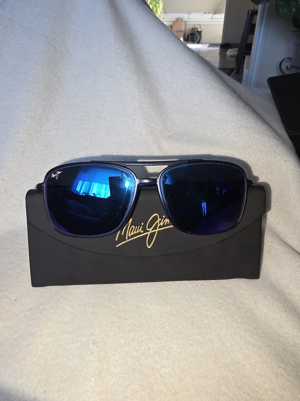 Maui Jim Kaupo Gap sunglasses featuring a matte black frame with blue mirrored